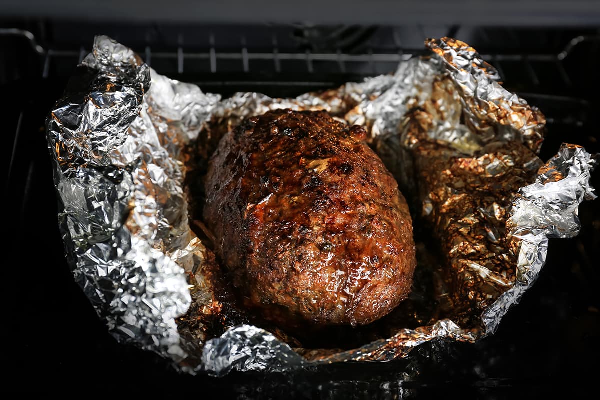 Why should you cover your meatloaf in the oven