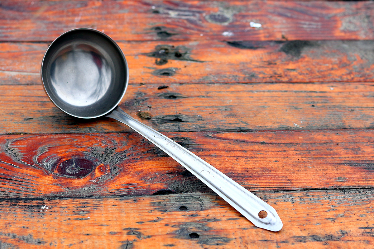 Big,Metal,Soop,Spoon,On,Old,Wooden,Table