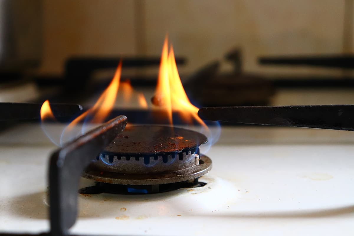 Orange flame on the gas stove Causes & Fixes